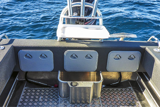 The re-design of the transom construction replaces the old cut-out stern with a transom wall that has internal stowage behind three hatches.