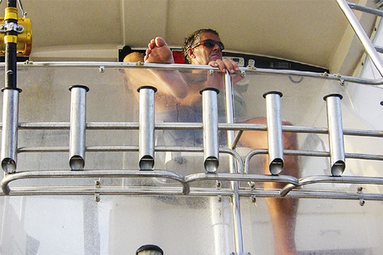 Bruce at the helm of Striker in Vanuatu. He skippered the 48ft Riviera on a number of offshore adventures.