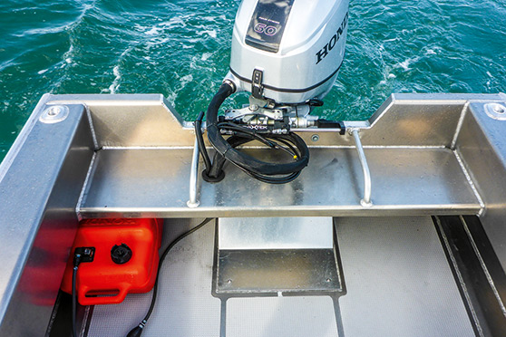 Across the transom are bench seats with grabrails which have space beneath for two 25-litre tote tanks.