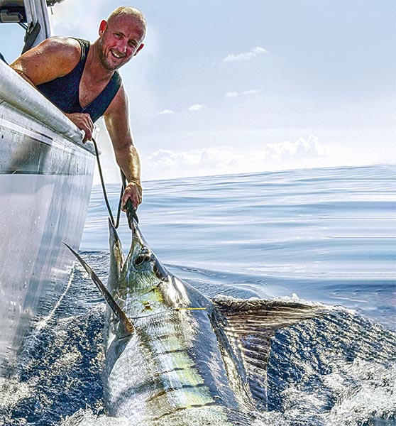 Dez Meinhold with the first fish, a tagged and released striped marlin, caught during a remarkable day out west last month.