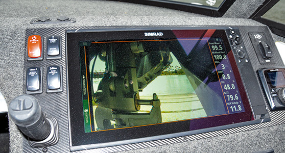 The camera view from the front wheel housing. The rocker switches to the left raise and lower the wheels, while the joystick controls speed and steering. 