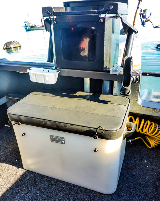 A removable, fully upholstered rear seat also doubles as an insulated catch storage bin.