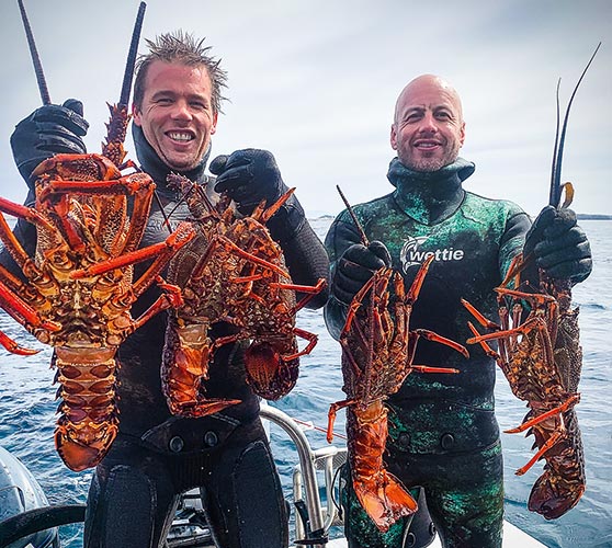 Cray diving doesn't get much better than this - Ant Buddle (left) and Tim Cook each with a brace of tasty big reds.
