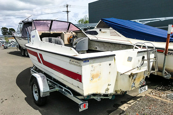 The stern quarter shot shows the clean, fresh lines of the Mclay hull.
