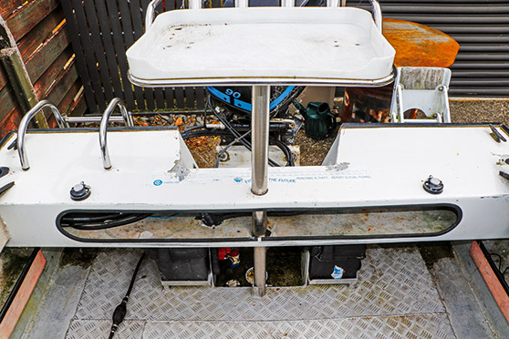 New Century marine batteries, battery switch and fuel filter were added under the transom.