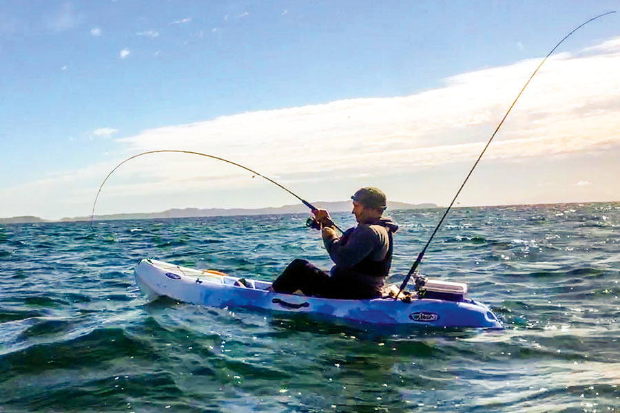 Josh on the move after he hooked a kingie in the shallows.