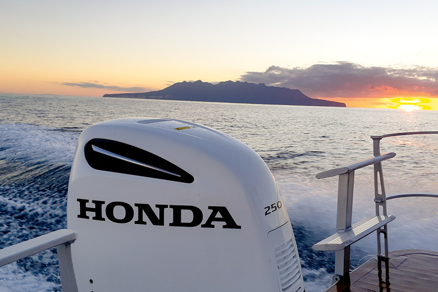 An epic sunset as the boat heads past Little Barrier.