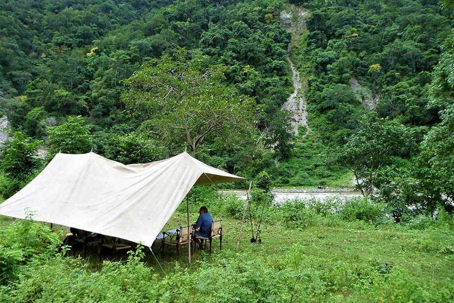 Tent camp on the West Ramganga River. It was bush with some terraced agricultural land on our side of the river and pure jungle on the other.
