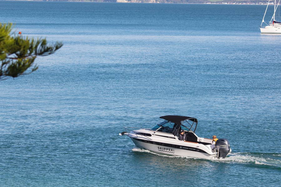 Getting into a boat with Skipperi